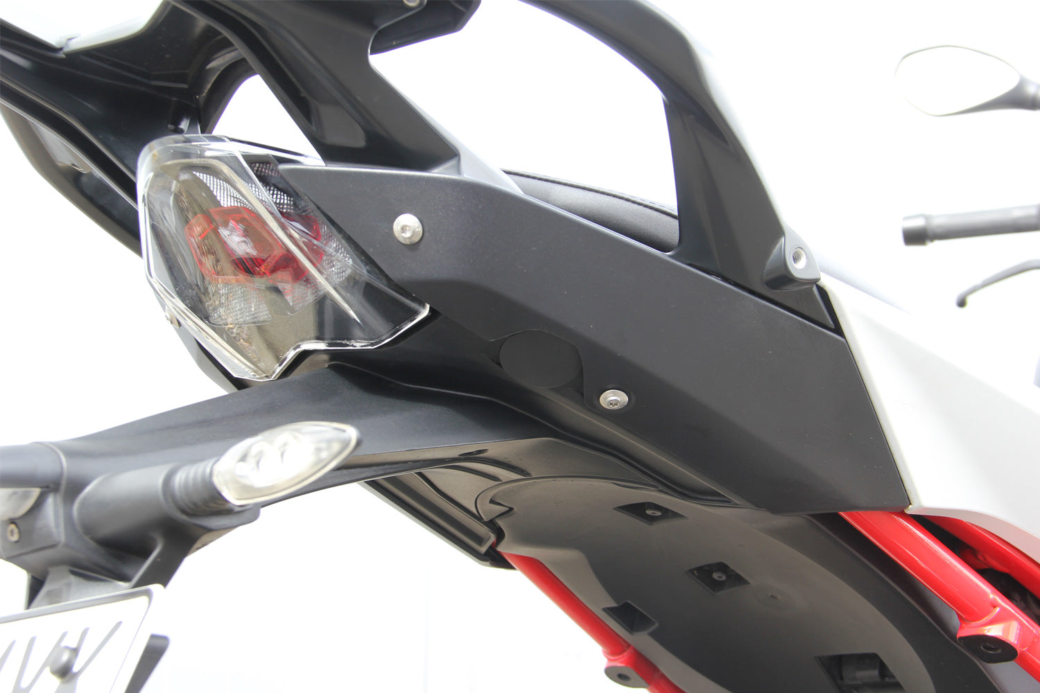 Tail fairing cover plugs